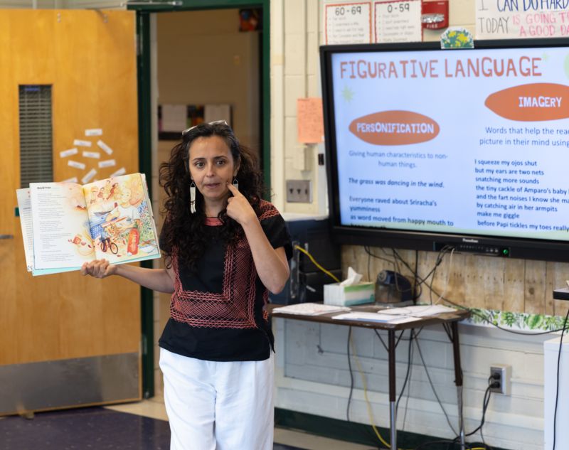Aida Salazar reads her book to students.