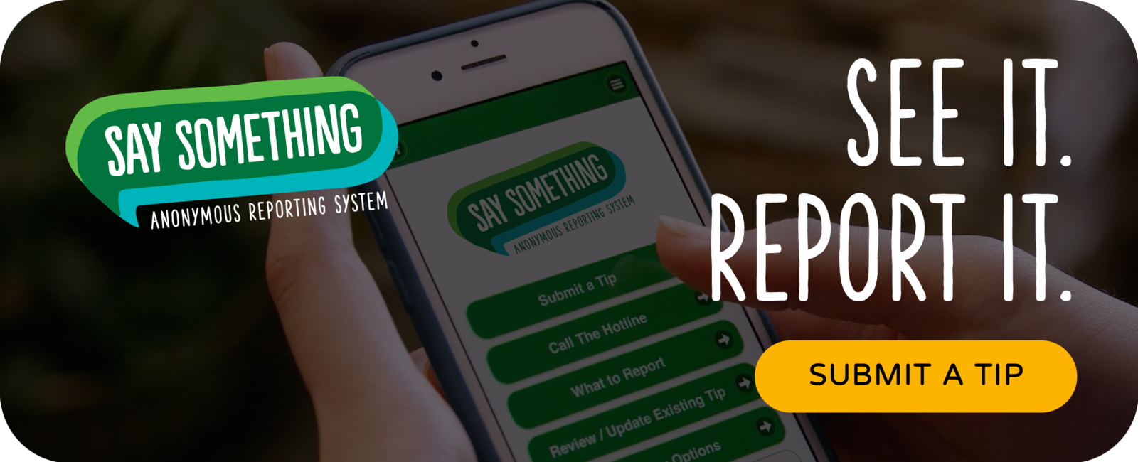 Say Something image showing person submitting tip on a phone