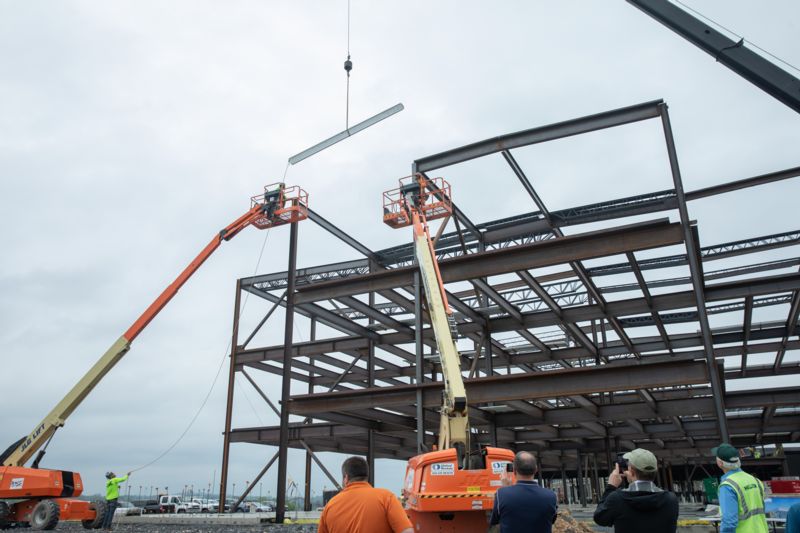 beam being lifted onto structure of Rocktown High School
