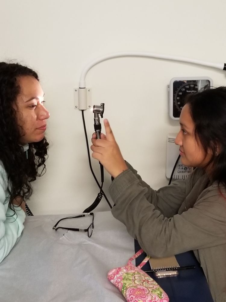 health care students practicing eye exam